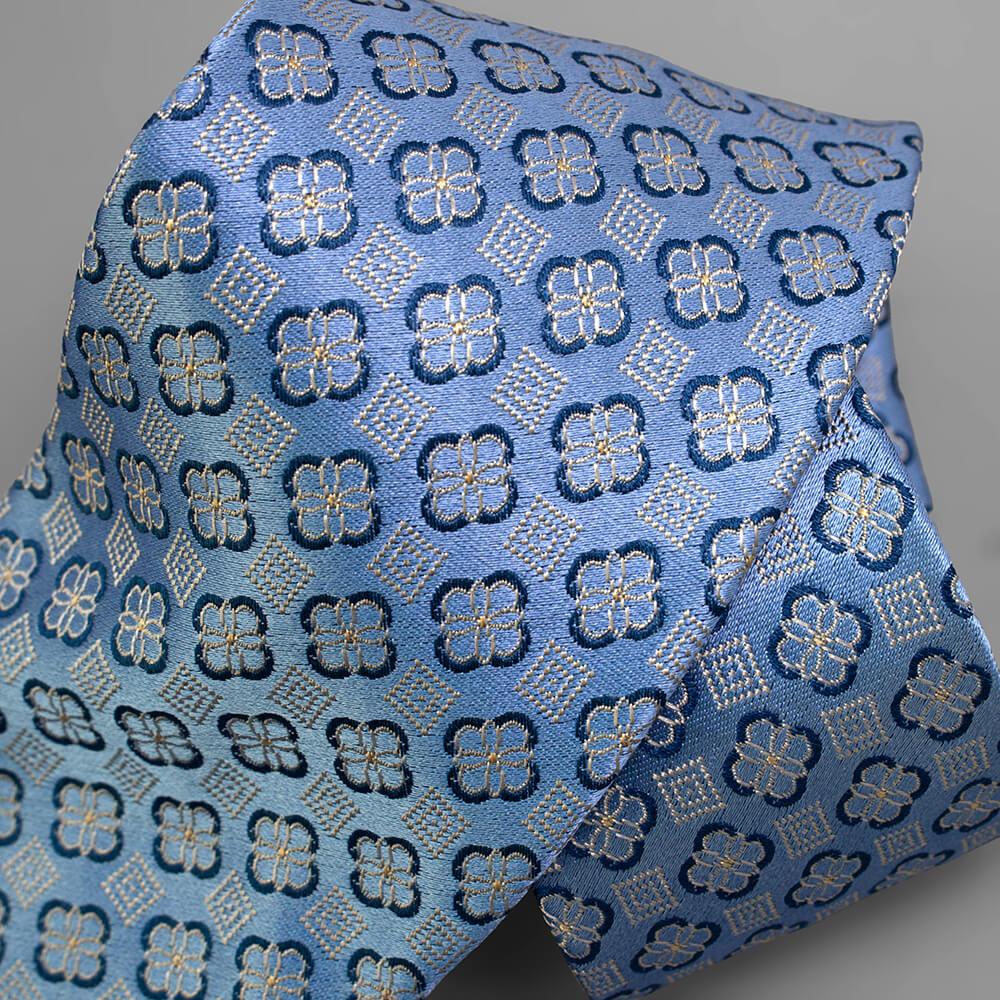 ジャカード織のライトブルー小紋柄ネクタイ｜Jacquard light blue tie with floral geometric pattern