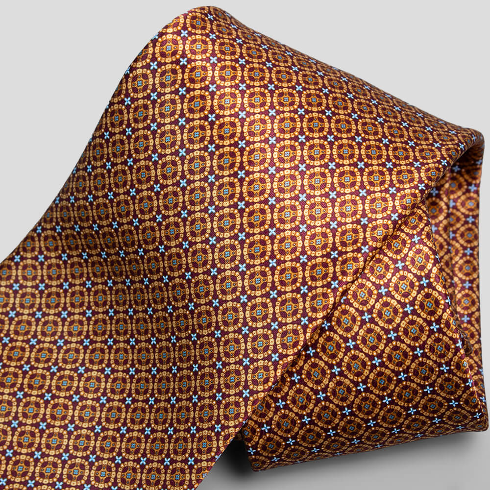 ステファノリッチのシルクプリントネクタイ、ブラウンとボルドーの円環模様デザイン｜Stefano Ricci silk printed necktie with brown and bordeaux circular geometric pattern